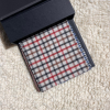 cream base with red and black check