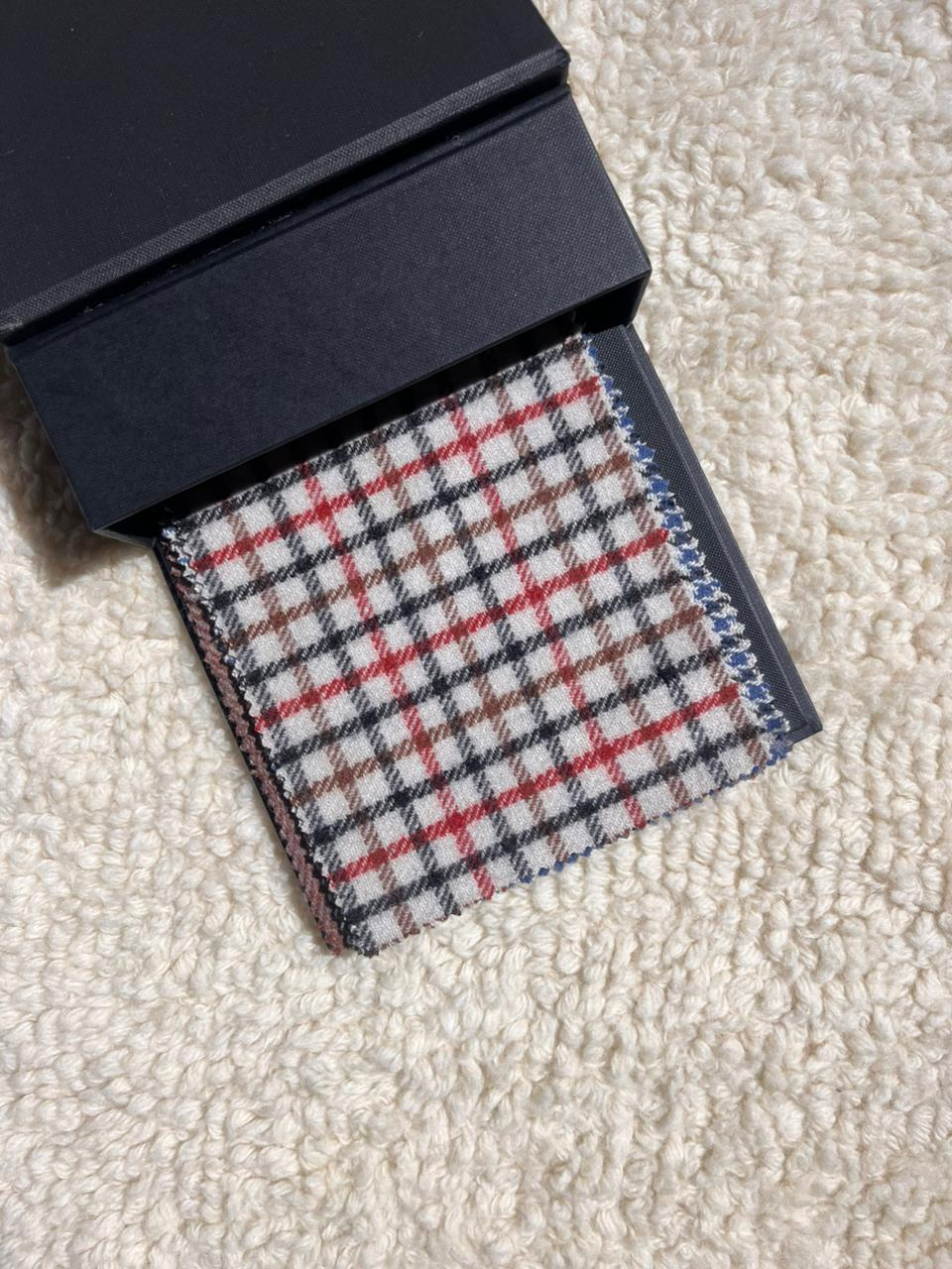 cream base with red and black check