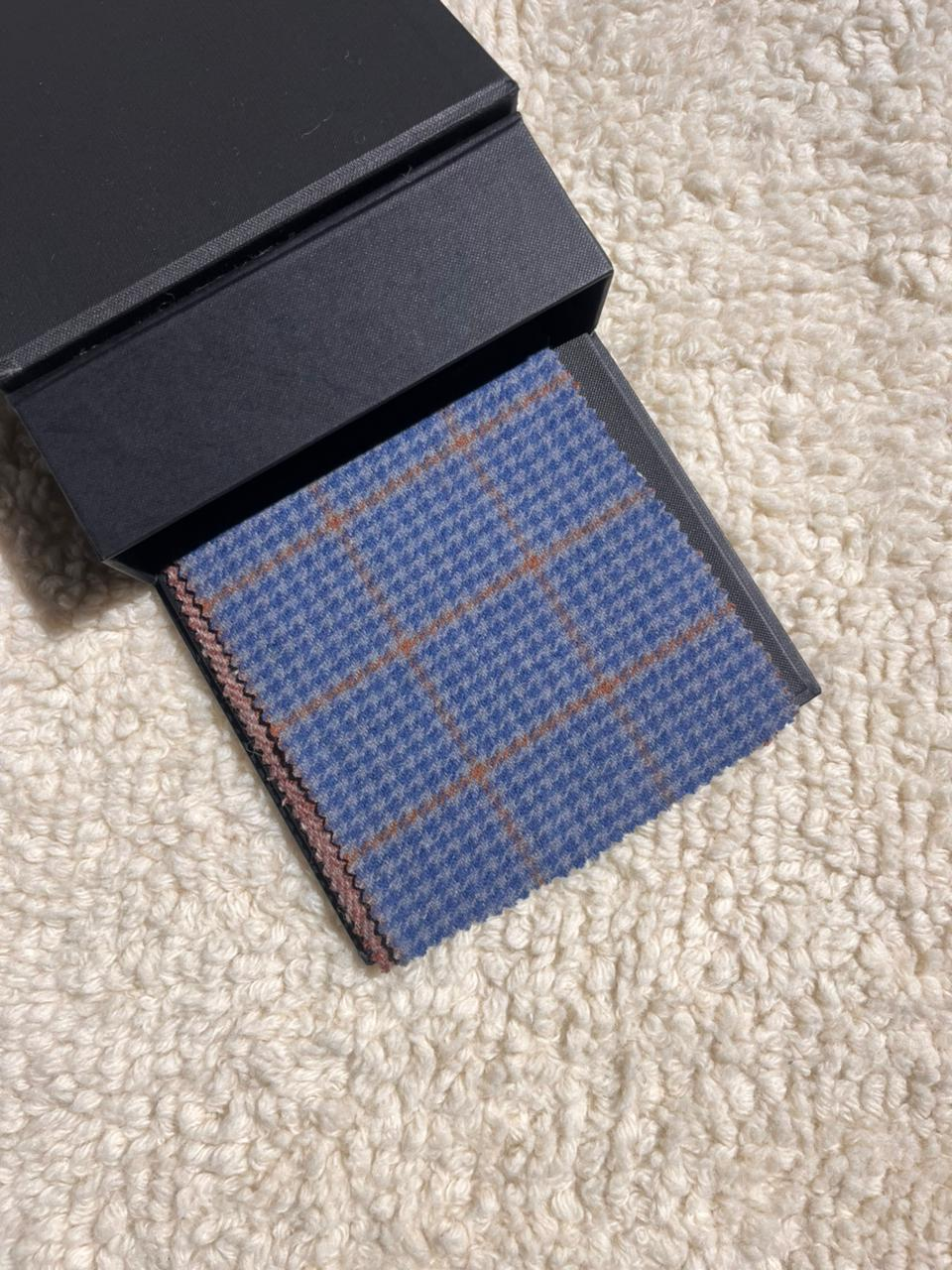 dusty blue with tan houndstooth.